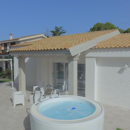 Ikebana Villas Porto Pino Beach Exterior photo