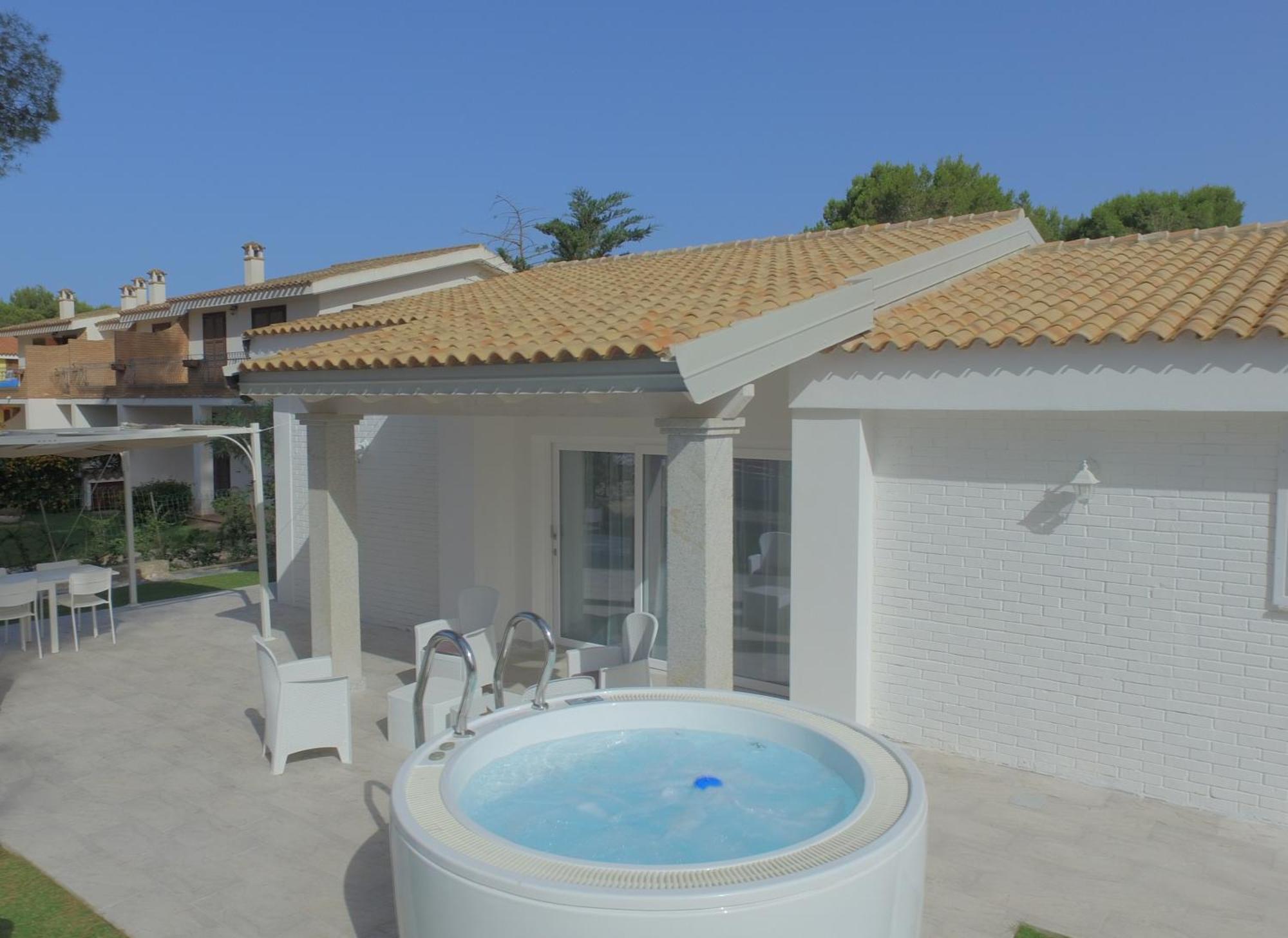 Ikebana Villas Porto Pino Beach Exterior photo